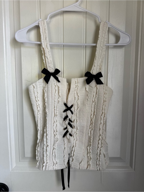 SHEIN Tops - SHEIN Cream Lace-Up Ruffle Tank Top with Black Bows